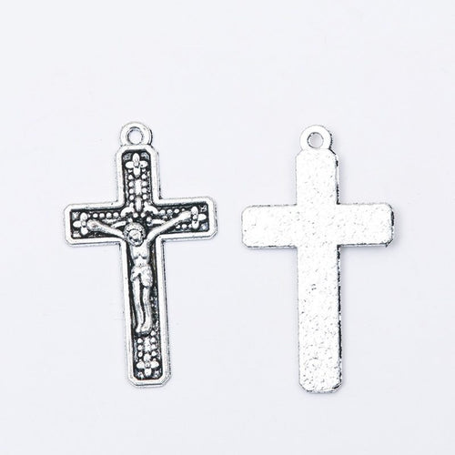 Crucifix Cross Charm Pendant front detail showing a raised crucifix figure and bordered cross