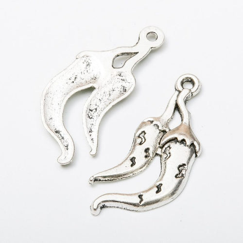 Closer view of the double chili pepper charm surface and hanging loop