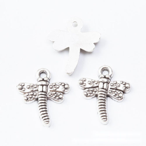 Close view showing the front and reverse details of the detailed dragonfly charm