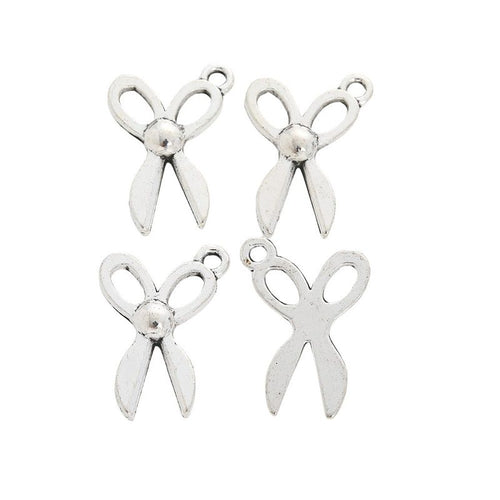 Grouped front and back views showing the details of small scissors charms