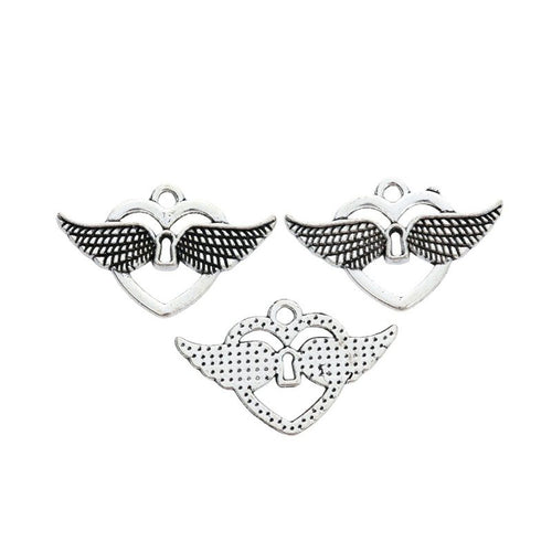 Open heart charm with spread wings and a small keyhole shown in front detail view