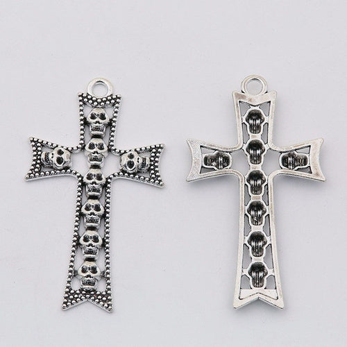 Front detail and finish comparison of the skull inset cross charm