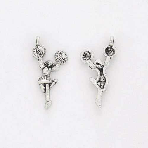 Close front view showing the shape and recessed details of the cheerleader girl charms