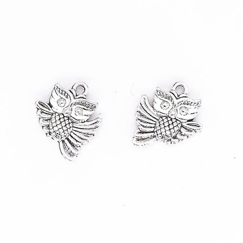 Owl metal component, reverse and front details on a white background.