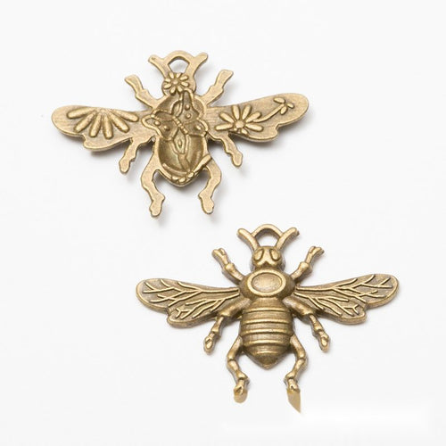 Close view of the bee charm showing its raised front pattern