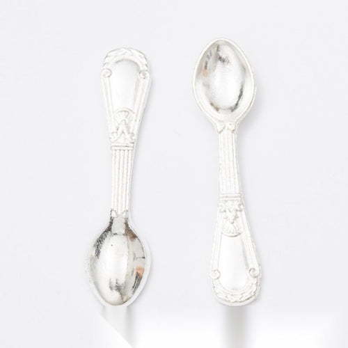 Closer front view of the ornate teaspoon shape and surface details.