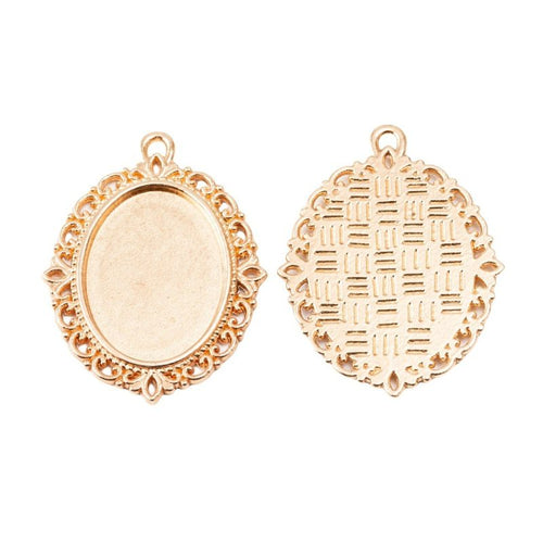 Ornate Oval Cabochon Pendant Tray in an antique tone shown from the front