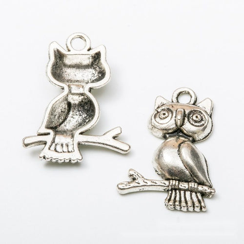 Front and reverse views of the owl on branch pair in one finish