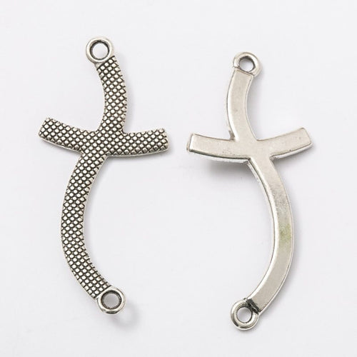 Close-up view of the curved cross metal charm connectors in two finishes showing its front and reverse metal details.