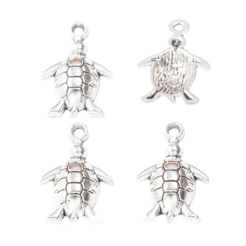 Close view of the sea turtle charm showing its raised front pattern