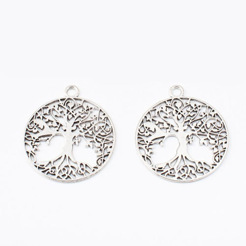 Close view of the front details on round tree of life charm pendants