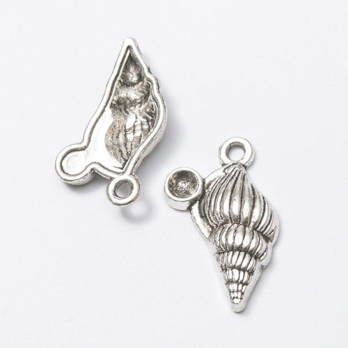 Spiral Seashell metal design front and back view on a light background