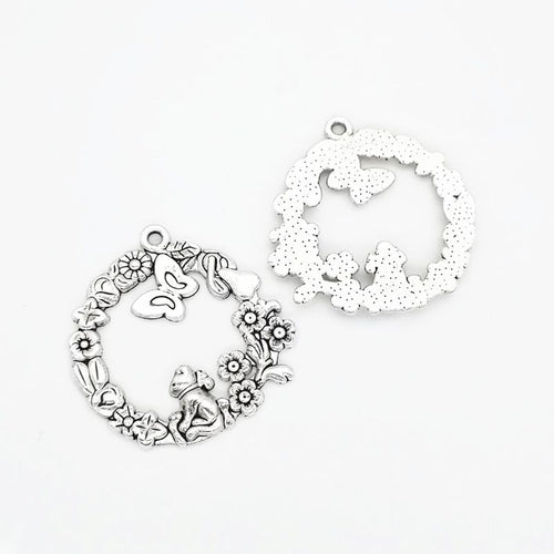 Angled detail views of garden wreath charms