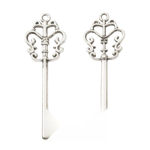 Additional front and reverse view of the ornate crown key charm