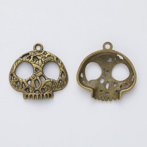 Close view of the front details on cutout skull charm pendants