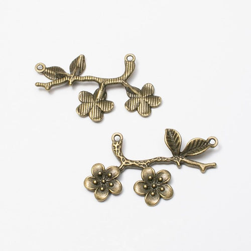 Antique Bronze, Gold Tone, Antique Gold, Antique Silver plum blossom branch connector shown in a detailed product view