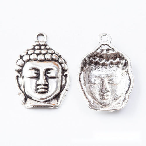 Front and reverse views of the buddha head in one finish