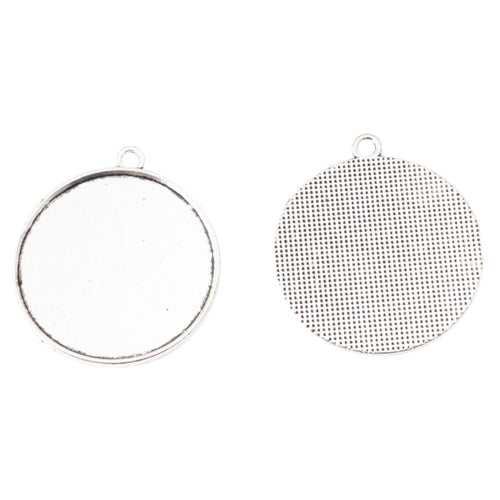 Close front view showing the shape and recessed details of the large round cabochon pendant settings