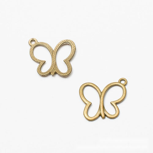 Close front view of outline butterfly charm showing smooth open wings and a small corner loop