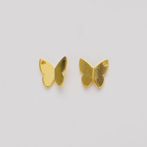 Close front and reverse view of the metal butterfly bead