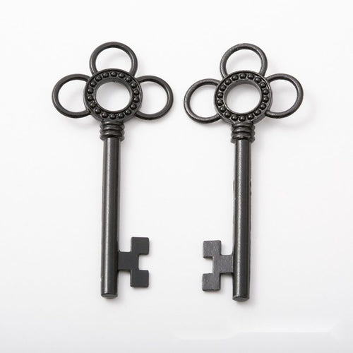 Flower-Bow Skeleton Key metal design front and back view on a light background