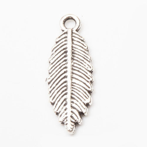 Alternate image of broad leaf charm showing available finishes and form