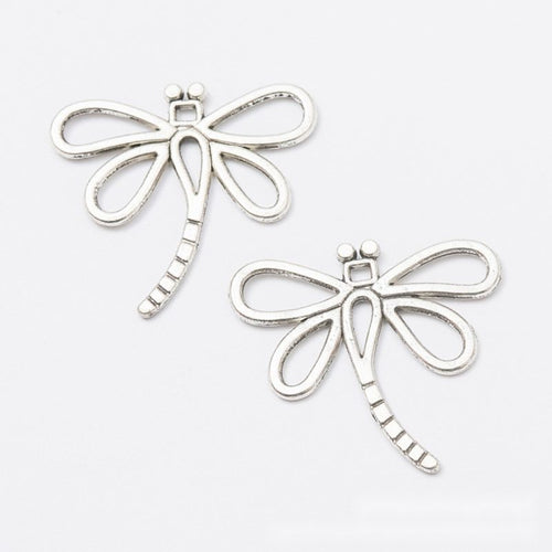 Close view of openwork dragonfly charm