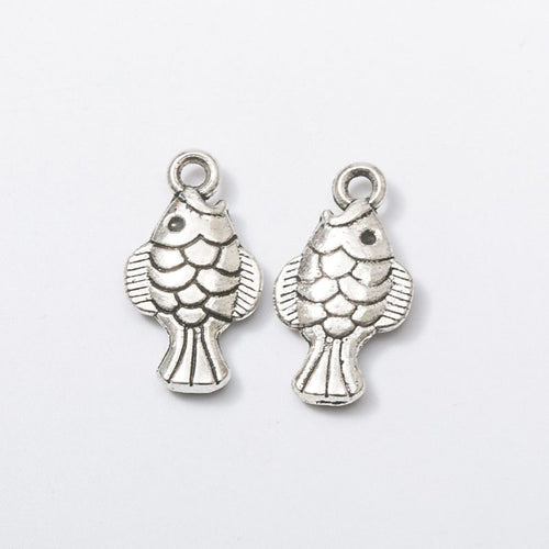 Closer view of the tiny fish charm surface and hanging loop