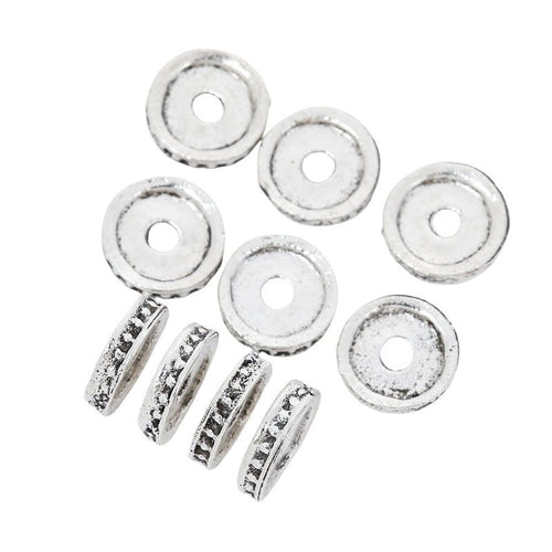 Flat round spacer bead with a raised rim and central hole shown in front detail view