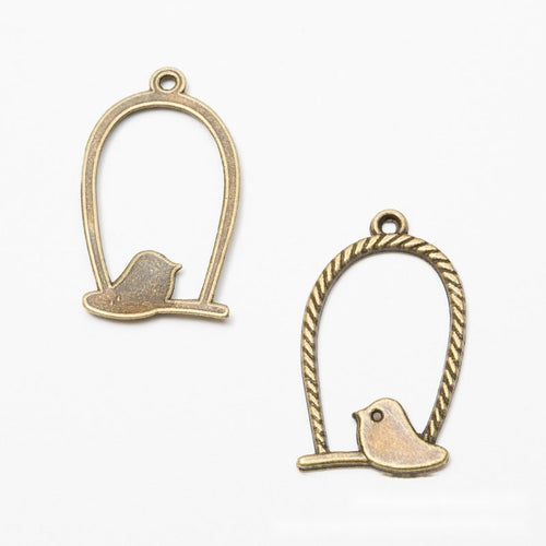 Close view of the an oval rope-edged cage surrounding a small perched bird