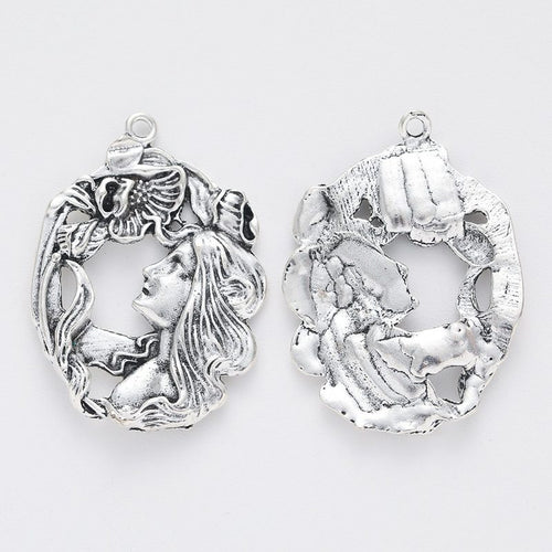 Front and reverse views of the art nouveau woman portrait charm