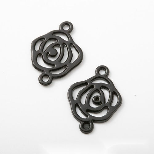 Close view showing the front and reverse details of the black floral and leaf connectors
