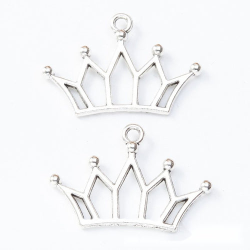 Front and reverse details of openwork crown charms on a white background