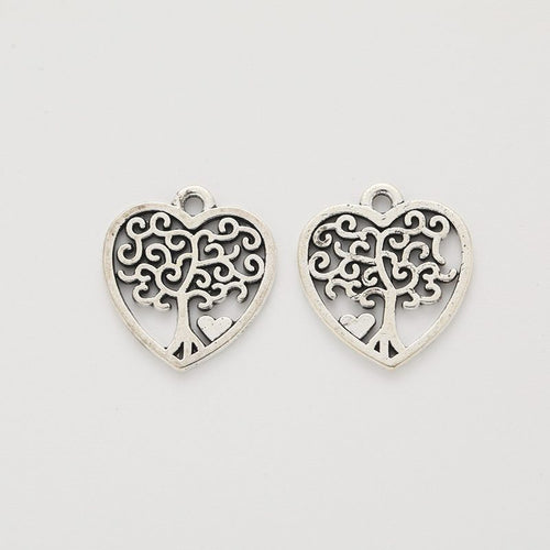 Front detail and finish comparison of the heart tree of life charm