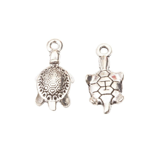 Front and reverse details of the patterned turtle metal charm pendant