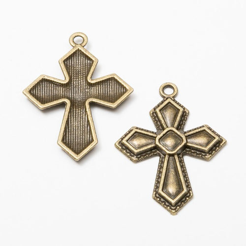 Front and reverse views of the faceted cross in one finish