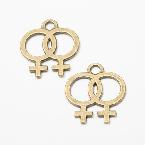 Front detail view of one pictured finish of double female symbol charms