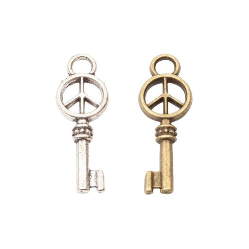 Peace Sign Skeleton Key Charm in an antique tone shown from the front