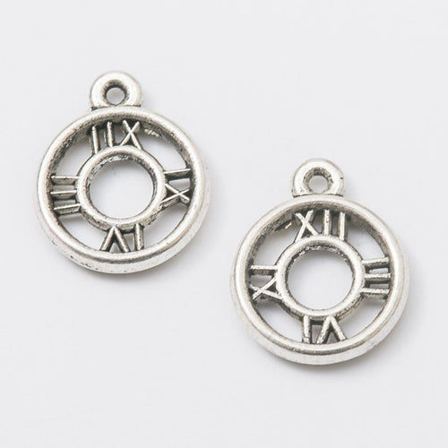 Close-up view of the round roman numeral clock face metal charms showing its front and reverse metal details.