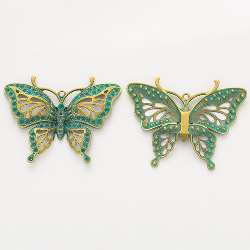 Close view showing the front details of the filigree butterfly charms