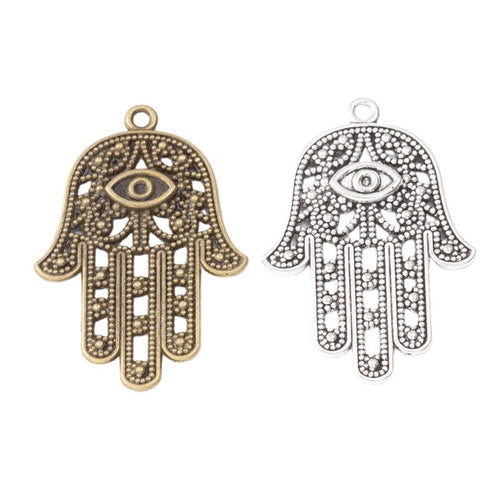 Close view of the front details on hamsa hand charm pendants