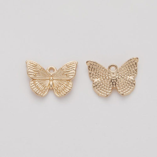 Close view showing the front and reverse details of the detailed butterfly charm