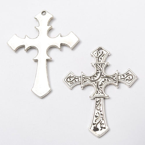 Close view of the assorted ornate crosses showing two different cross silhouettes with open and raised details