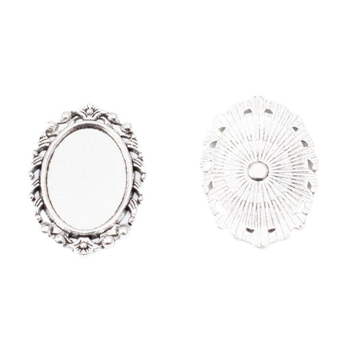 Angled detail views of oval bezel settings