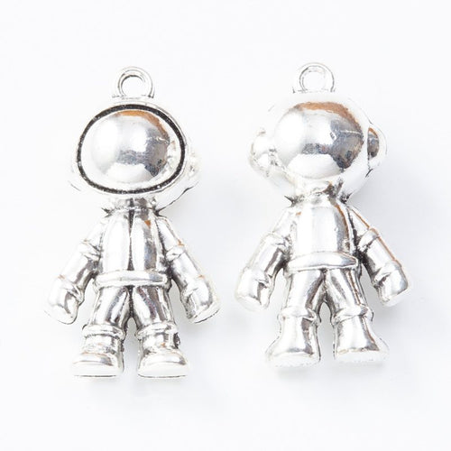Closer view of the rounded astronaut charm surface and hanging loop