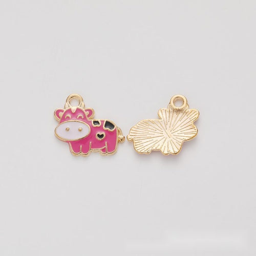 Cartoon cow metal component, front and reverse detail on white