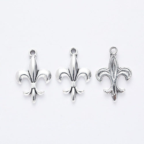 Front and reverse views of the fleur de lis charm