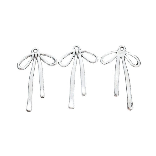 Grouped long ribbon bow components showing repeated front details and finish
