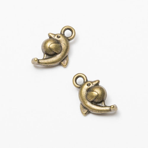 Detailed front and back view of 卷身海豚 charm on a white background