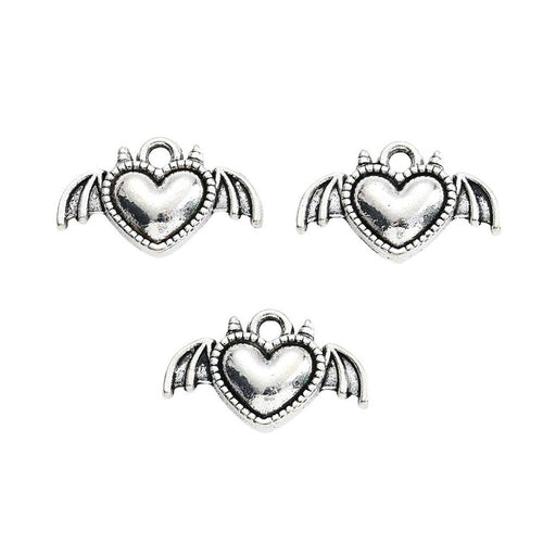 Close front and reverse view of the metal bat-wing heart charm